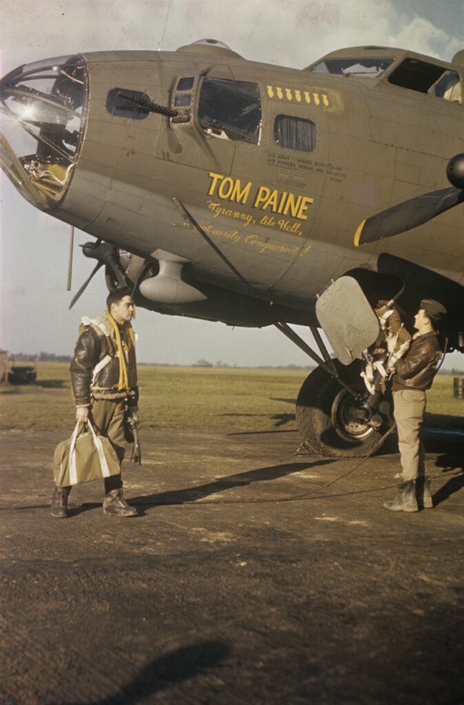Airmen of the 388th Bomb Group climb aboard their B-17 Flying Fortress (serial number 42-30793) nicknamed "Tom Paine" before a mission.
